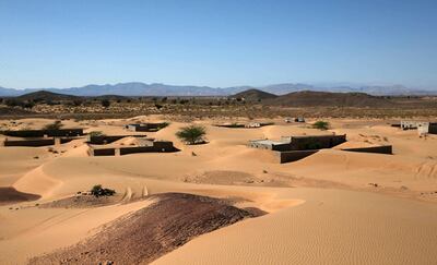 This picture taken on December 31, 2020, shows abandoned houses in the Omani village of Wadi al-Murr, about 400 kms (250 miles) southwest of the capital Muscat. Encroaching desert sands have left little evidence that Wadi al-Murr ever existed, but former inhabitants, while resigned to its destruction, are trying to preserve its memory.
The advance of the desert is not specific to the sultanate of Oman, and experts say climate change is one of the factors propelling the phenomenon in different parts of the world.
 / AFP / MOHAMMED MAHJOUB
