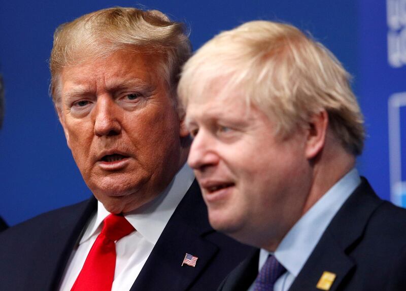 FILE PHOTO: Britain's Prime Minister Boris Johnson welcomes U.S. President Donald Trump at the NATO leaders summit in Watford, Britain December 4, 2019. REUTERS/Peter Nicholls/Pool/File Photo
