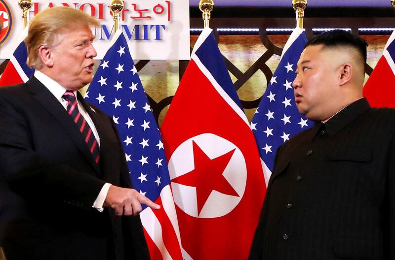 FILE PHOTO: U.S. President Donald Trump speaks to North Korean leader Kim Jong Un after shaking hands before their one-on-one chat during the second U.S.-North Korea summit at the Metropole Hotel in Hanoi, Vietnam February 27, 2019. REUTERS/Leah Millis/File Photo