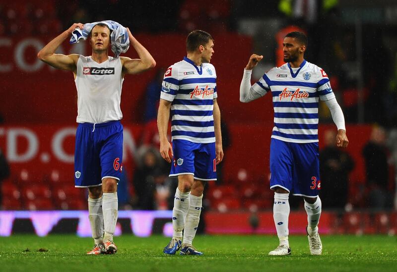 MANCHESTER, ENGLAND - NOVEMBER 24:  Clint Hill of Queens Park Rangers and his team-mates look dejected at the end of the Barclays Premier League match between Manchester United and Queens Park Rangers at Old Trafford on November 24, 2012 in Manchester, England.  (Photo by Laurence Griffiths/Getty Images)