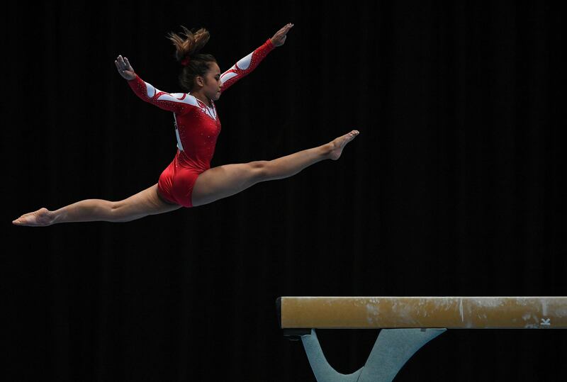 Indonesia's Rifda Irfanaluthfi competes in the team artistic gymnastic balance beam event during the 29th Southeast Asian Games (SEA Games) in Kuala Lumpur. Mohd Rasfan / AFP