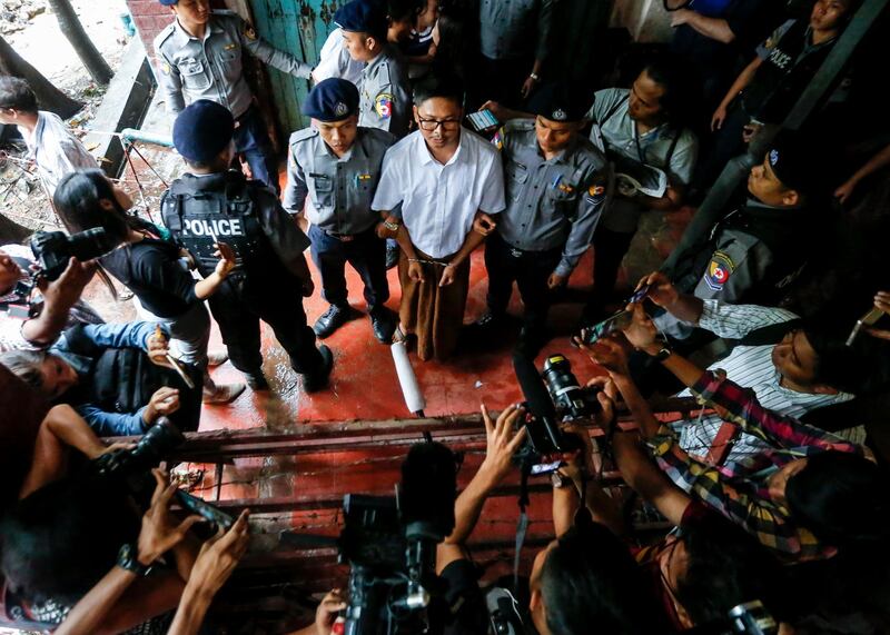 Detained Reuters journalist Wa Lone talks to media as he is escorted by police after his trial at the court in Yangon, Myanmar. Lynn Bo Bo/EPA