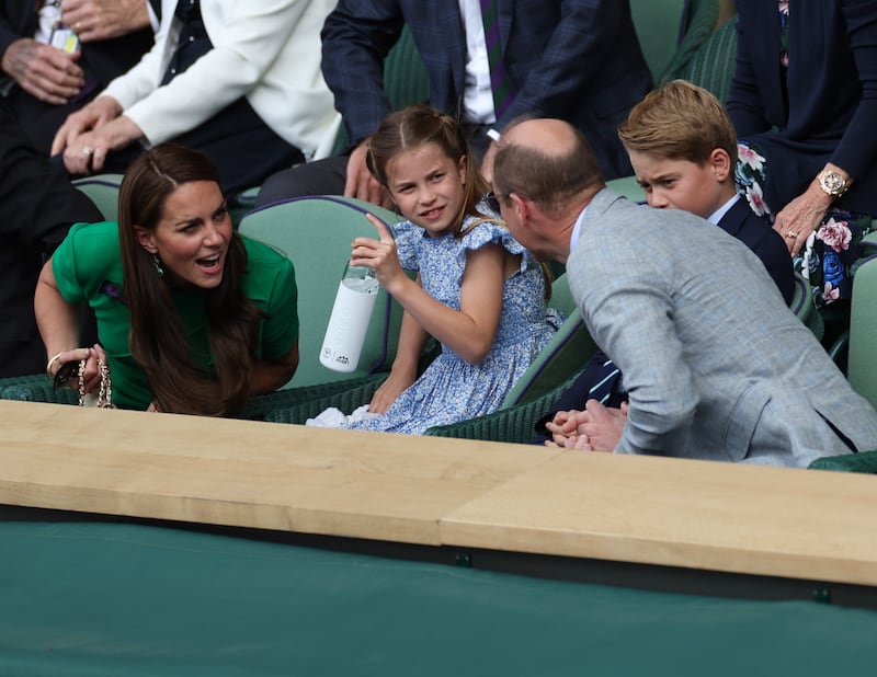 The Cambridges chat during the men's singles final. EPA
