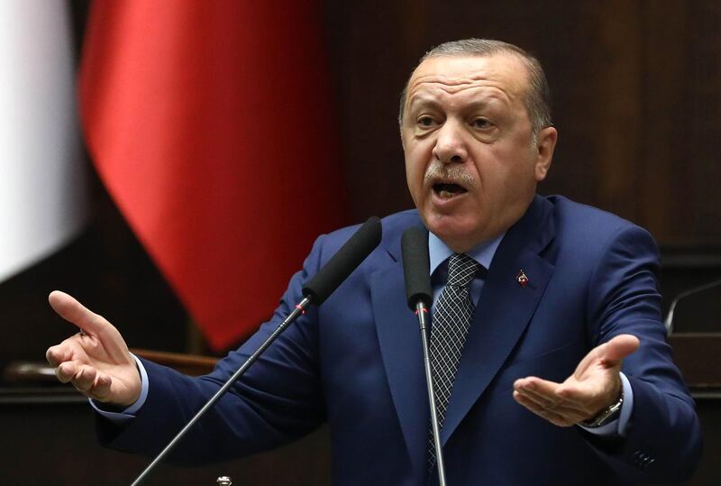 Turkish President and leader of Turkey's ruling Justice and Development (AK) Party Recep Tayyip Erdogan speaks during his party's parliamentary group meeting at the Grand National Assembly of Turkey in Ankara, on October 30, 2018.   / AFP / ADEM ALTAN
