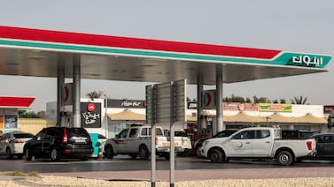 Vehicles queue to refuel at a petrol station in Dubai. AFP