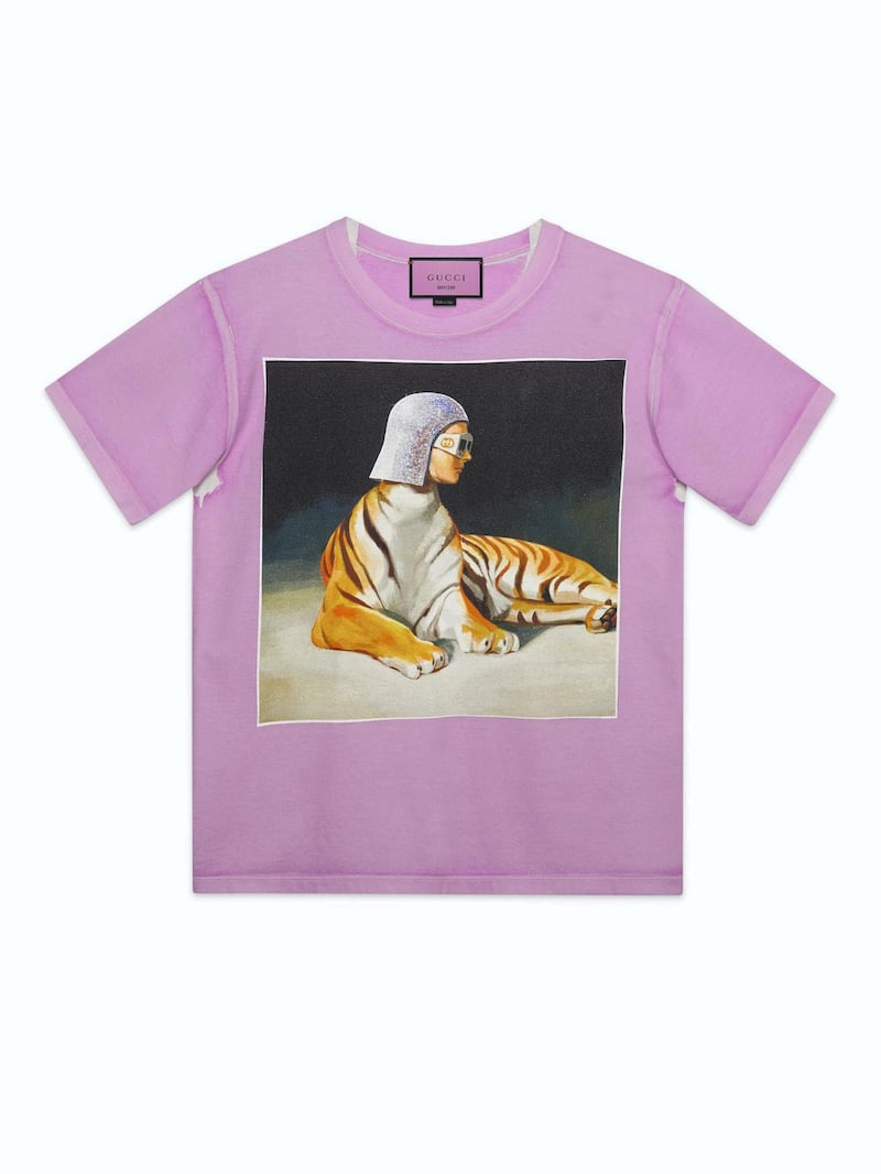 <p>Monreal&#39;s paintings in T-shirt form show a tiger with a woman&#39;s head clad in diamante chainmail</p>