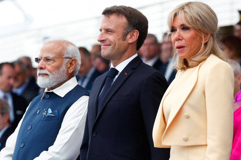 From left, Mr Modi, Mr Macron and first lady Brigitte Macron attend the Bastille Day military parade. AFP
