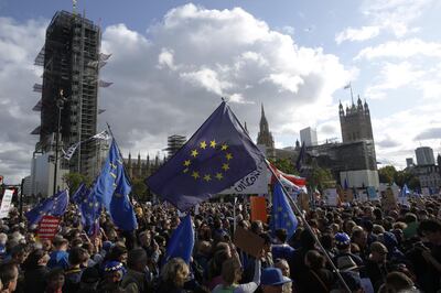 Demonstrators hold European Union (EU) on Parliament Square during a People's Vote march in London, U.K., on Saturday, Oct. 19, 2019. Boris Johnson is under pressure to ask the European Union to postpone Brexit after Parliament refused to approve the deal the prime minister negotiated. Photographer: Luke MacGregor/Bloomberg