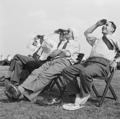 Spectators shield their eyes against the sun at Farnborough Airshow in 1959. Getty Images
