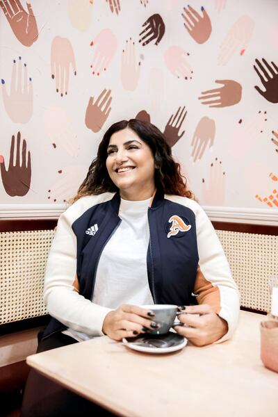 Body-positivity activist Lu D'Souza wearing the classic 'A' jacket, without the customised badge. Courtesy Adidas 