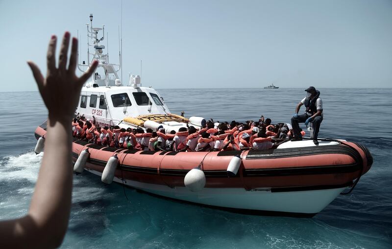 epa06802822 A handout photo made available by NGO 'SOS Mediterranee' on 12 June 2018 shows some of the 629 migrants boarding rescue vessel 'Aqarius' in the Mediterranean. The rescue vessel 'Aquarius', carrying a total of 629 migrants who were rescued off the Libyan coast, was denied access to ports in Italy and Malta in a diplomatic row between the two countries. Spain and France authorized on 11 June 2018 the landing of the ship at Valencia's port to avoid a humanitarian catastrophe.  EPA/KENNY KARPOV / HANDOUT MANDATORY CREDIT HANDOUT EDITORIAL USE ONLY/NO SALES HANDOUT EDITORIAL USE ONLY/NO SALES