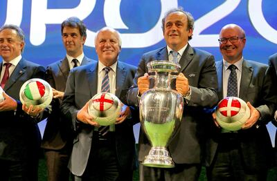File photo dated 19-09-2014 of UEFA President Michel Platini and the European Championship trophy. Issue date: Tuesday June 1, 2021. PA Photo. Even the original architect of Euro 2020, former UEFA president Michel Platini, accepted it was "perhaps a bit of a zany idea". Staging arguably the third-biggest sporting event on the planet in 12 cities spread across the whole of Europe in one month always looked like a logistical challenge - the coronavirus pandemic turned it into a potential nightmare. See PA story SOCCER Euro 2020 Overview. Photo credit should read John Walton/PA Wire.
