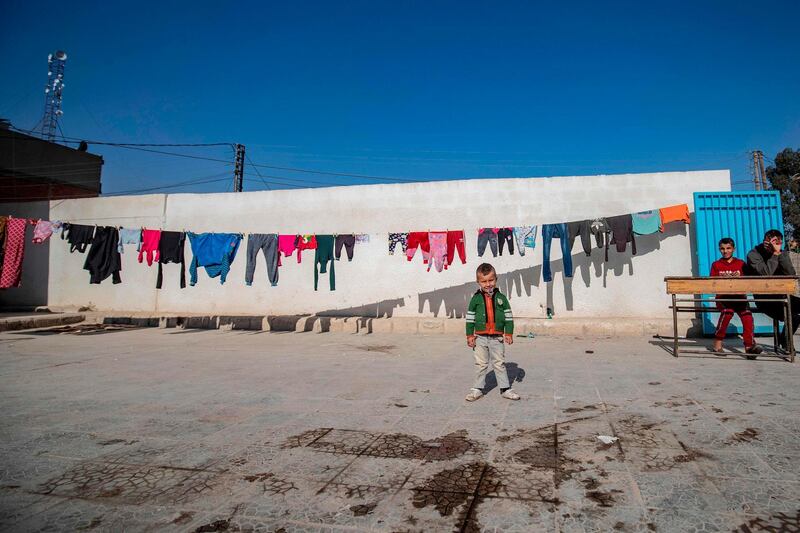 Internally displaced Syrians are pictured at a school turned into a makeshift camp in the northern Syrian city of Hasakeh. AFP