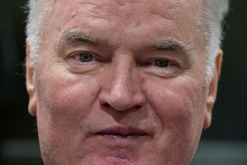 FILE - In this Wednesday, Nov. 22, 2017 file photo, Bosnian Serb military chief Ratko Mladic enters the Yugoslav War Crimes Tribunal in The Hague, Netherlands, to hear the verdict in his genocide trial. Former Bosnian Serb military chief Gen. Ratko Mladic said Friday, July 24, 2020 that his health is bad and getting worse, as his lawyers sought another delay in a United Nations hearing in his appeal against convictions for genocide, war crimes and crimes against humanity. (AP Photo/Peter Dejong, Pool, File)