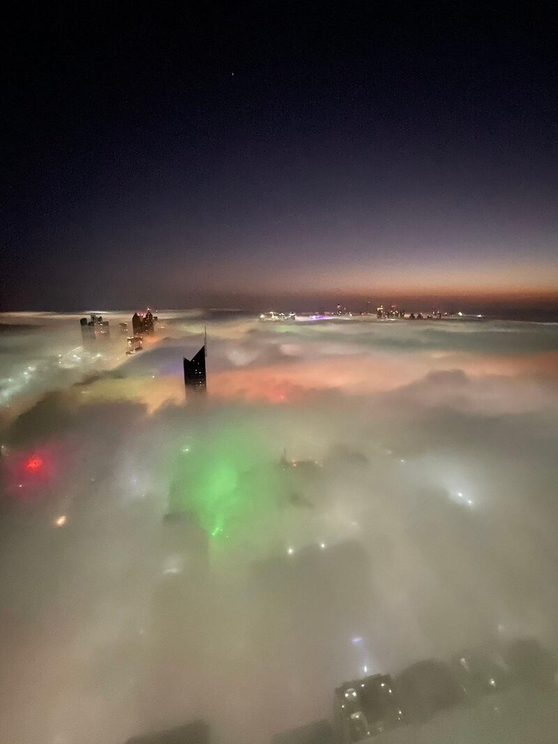 City lights in Abu Dhabi illuminating the fog from below on Thursday. Courtesy Jono Haysom 