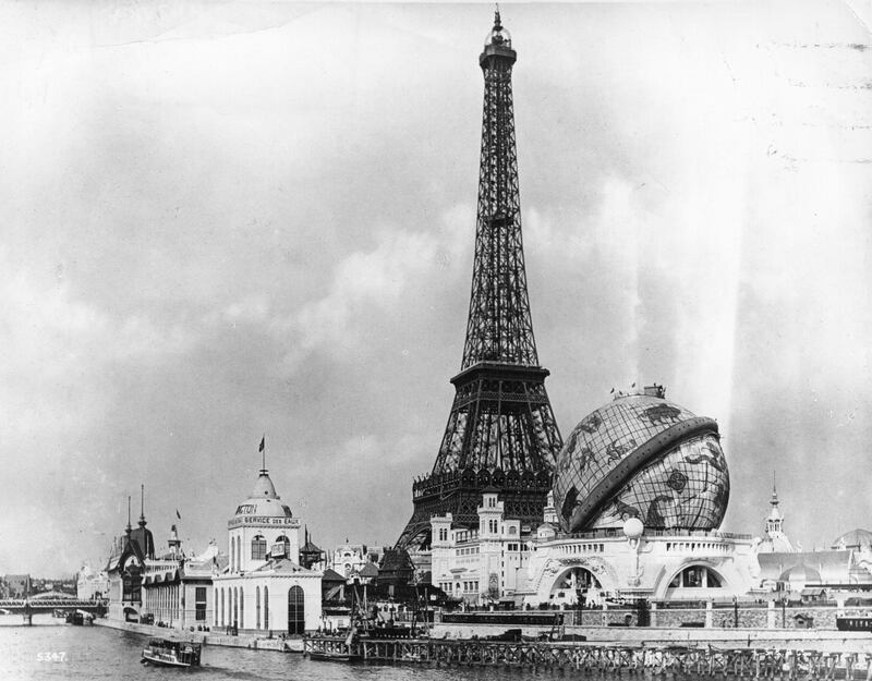 View at the 'Exposition Universelle' across the River Seine towards the Eiffel Tower, and the 'Globe Celeste'. The Eiffel Tower, built to commemorate the 100th anniversary of the French Revolution, was the central focus of both the 1889 and the 1900 Paris Exhibition site.   (Photo by London Stereoscopic Company/Getty Images)