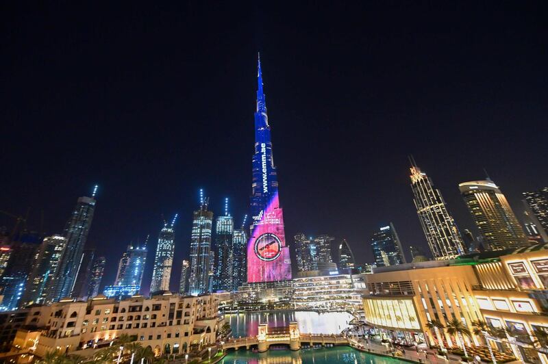 A picture taken on July 19, 2020 shows Dubai's Burj Khalifa lit up in support of the United Arab Emirates "Hope" Mars probe, ahead of it's expected launch from Japan. The probe is one of three racing to the Red Planet, with Chinese and US rockets also taking advantage of the Earth and Mars being unusually close: a mere hop of 55 million kilometres (34 million miles). "Hope" -- Al-Amal in Arabic -- is expected to start orbiting Mars by February 2021, marking the 50th anniversary of the unification of the UAE. / AFP / Giuseppe CACACE
