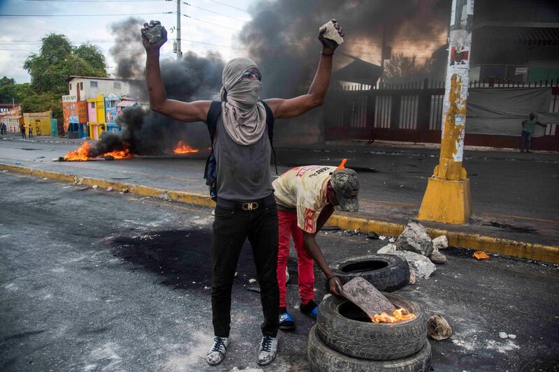 Protesters set up barricades in Port-au-Prince, Haiti. EPA