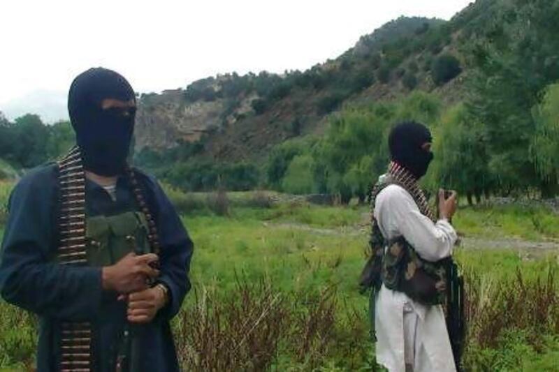 Pakistani Taliban stand alert in their stronghold of Shawal in the Pakistani tribal region of South Waziristan. Stepped-up US drone strikes, Pakistani military offensives and dwindling cash reserves have driven out many of the Arabic-speakers in recent years,
