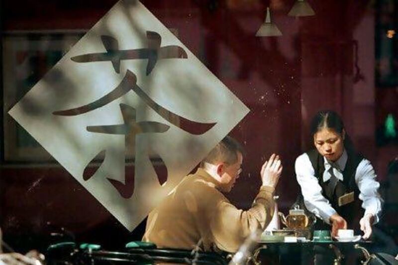 A tea house in Shanghai. In China, where tea is more a part of the culture than a mere drink, the growing fondness for expensive tea shops and tea houses is unsurprising. Eugene Hoshiko / AP Photo