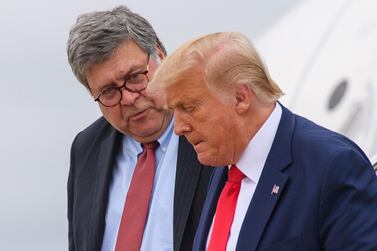 In this file photo taken on September 1, 2020 US President Donald Trump (R) and US Attorney General William Barr step off Air Force One upon arrival at Andrews Air Force Base in Maryland. US Attorney General Bill Barr gave federal prosecutors blanket authorisation on November 9 to open investigations into voting irregularities in the Presidential Election. AFP