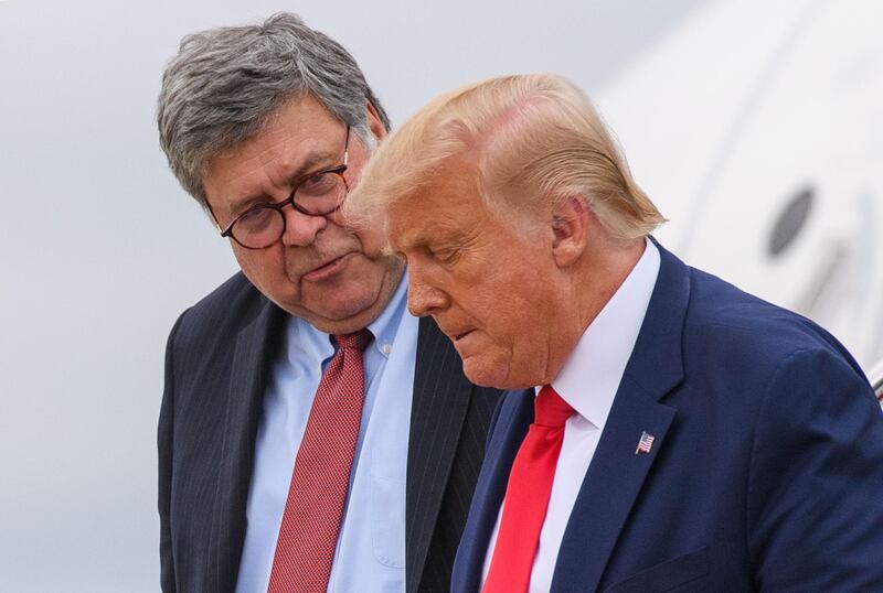 (FILES) In this file photo taken on September 1, 2020 US President Donald Trump (R) and US Attorney General William Barr step off Air Force One upon arrival at Andrews Air Force Base in Maryland. US Attorney General Bill Barr gave federal prosecutors blanket authorization on November 9 to open investigations into voting irregularities, as President Donald Trump claimed that he lost the presidential election due to fraud.
Barr, long a close defender of Trump, stresed that his letter to US attorneys around the country was not an indication that the Justice Department had evidence yet of genuine cases.
 / AFP / MANDEL NGAN
