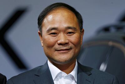 FILE PHOTO: Geely's founder and chairman, Li Shufu, poses for a picture during an event in Berlin, Germany, October 20, 2016. REUTERS/Hannibal Hanschke/File Photo