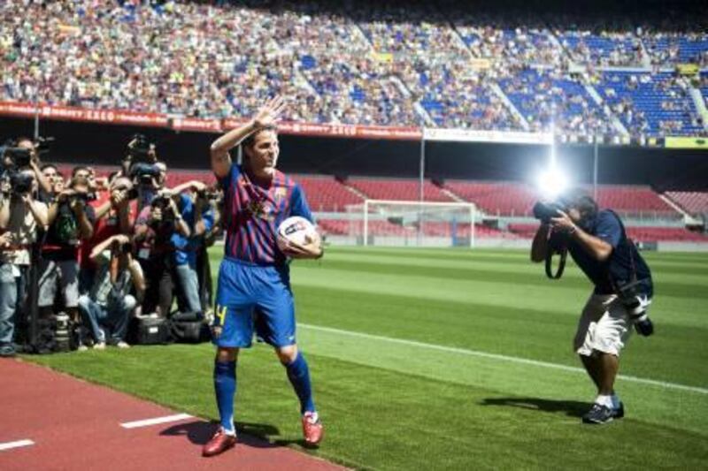 BARCELONA, SPAIN - AUGUST 15:  Cesc Fabregas gestures during his presentation as the new signing for FC Barcelona at Camp Nou sports complex on August 15, 2011 in Barcelona, Spain.  (Photo by David Ramos/Getty Images) *** Local Caption ***  121178065.jpg