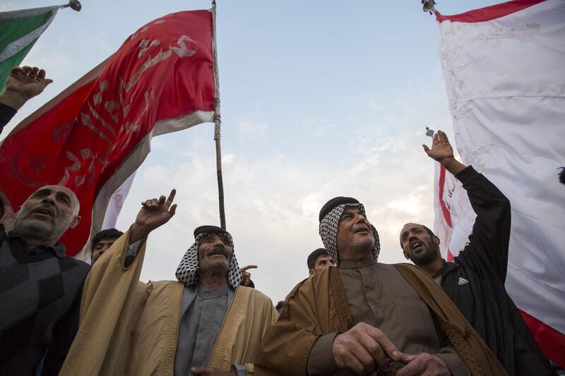 Tribal elders from the southern Iraqi city of Basra take part in a march to support the the country's top Shiite cleric, Grand Ayatollah Ali Sistani. AFP