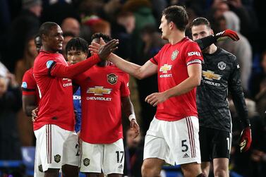 Manchester United's Odion Ighalo (left) celebrates victory with Harry Maguire after the Premier League match at Stamford Bridge. PA