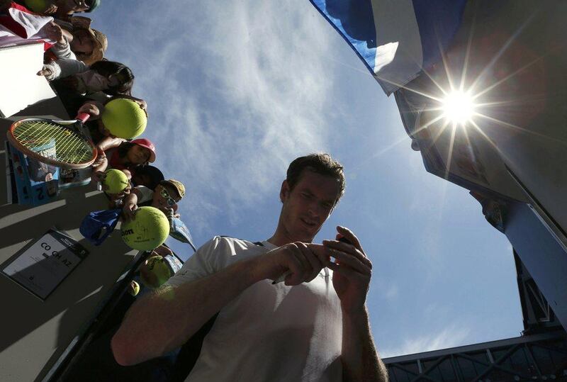 Andy Murray signs autographs after winning his first round match against Germany's Alexander Zverev at the Australian Open tennis tournament at Melbourne Park, Australia, January 19, 2016. REUTERS/Jason Reed