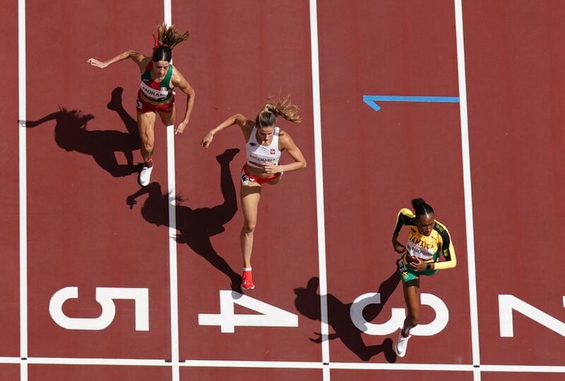 From left, Paola Moran of Mexico, Natalia Kaczmarek of Poland and Stephenie McPherson of Jamaica during the first round of the women's 400m in the Olympic Stadium in Tokyo.