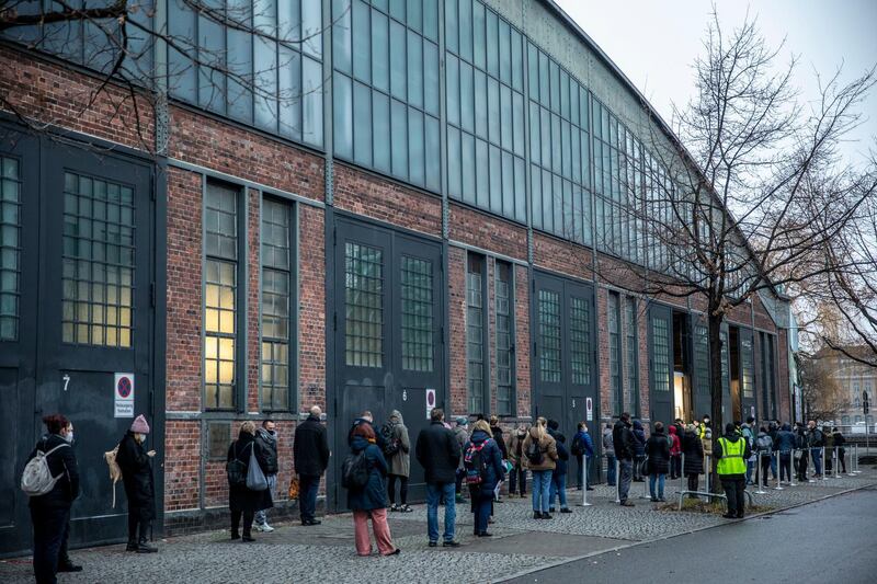 People line up to enter Treptow Arena Berlin vaccine center in Berlin, Germany. Getty Images