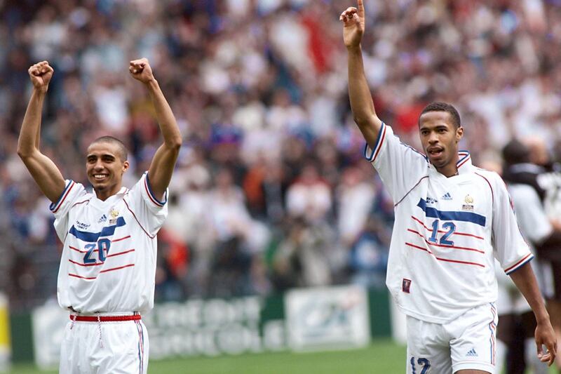 (FILES) In this file photo taken on July 03, 1998 French players David Trezeguet (L) and Thierry Henry celebrate after the penalty shoot out during the 1998 Soccer World Cup quarter final match between France and Italy, at the Stade de France in Saint-Denis  / AFP PHOTO / Pedro UGARTE