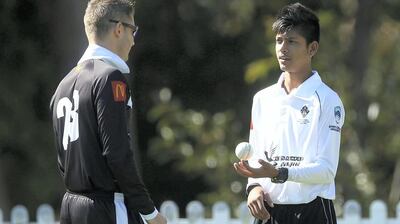 Sandeep Lamichhane, right, spent time with Michael Clarke during his development as a player. Mark Metcalfe / Getty Images