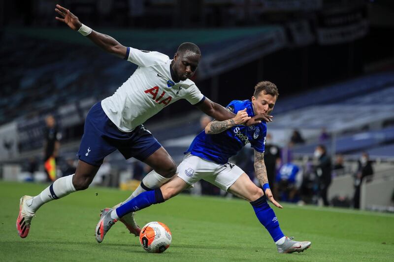Tottenham's Moussa Sissoko, left, duels for the ball with Everton's Bernard. AP
