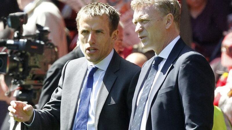 Phil Neville, left, the former United full-back, was on the United coaching staff last term as they struggled under David Moyes before finishing the campaign seventh in the Premier League. Agency