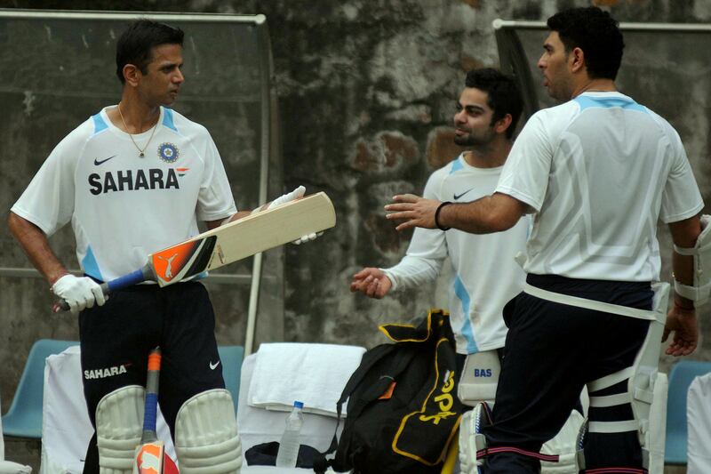 NEW DELHI, INDIA - NOVEMBER 04: Rahul Dravid, Virat Kohli and Yuvraj Singh during a practice session a day before the first test match against West Indies at Ferozeshah Kotla in New Delhi on Saturday. (Photo by Qamar Sibtain/India Today Group/Getty Images) *** Local Caption *** Rahul Dravid;Virat Kohli;Yuvraj Singh