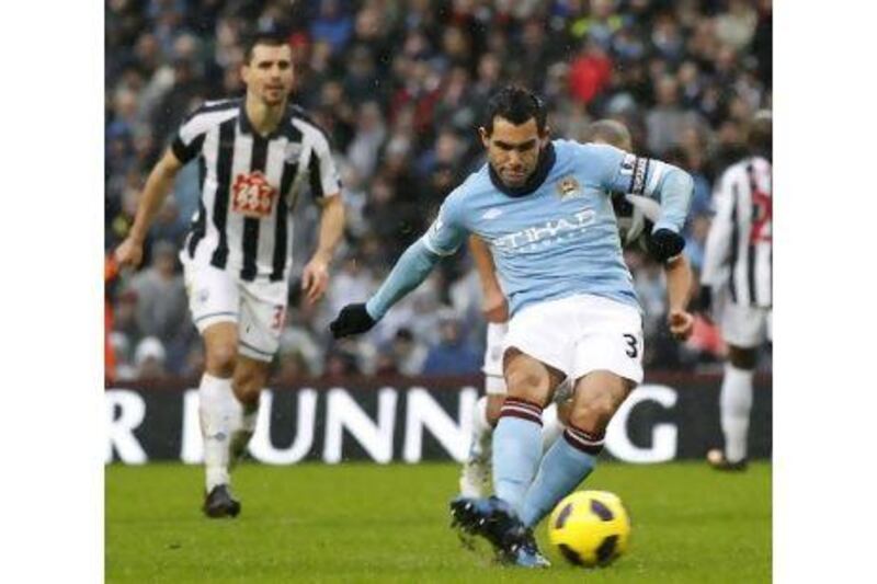 Manchester City's Carlos Tevez scores the first of his three goals against West Bromwich.