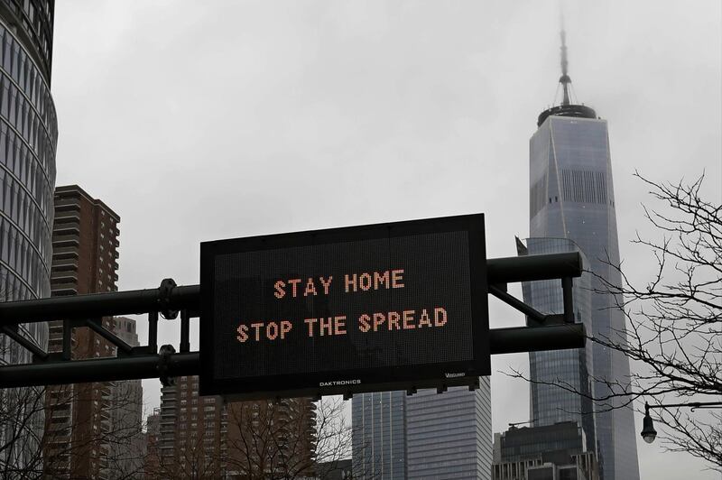 epa08316470 A traffic advisory sign on the West Side Highway instructs motorists to 'Stay Home Stop The Spread' in New York, New York, USA, 23 March 2020. Last week New York Governor Andrew Cuomo issued a statewide shut down of all non-essential businesses and a ban on all non-solitary outride activities that is set begin on Sunday night in effort to stop the spread of the coronavirus.  EPA/Peter Foley
