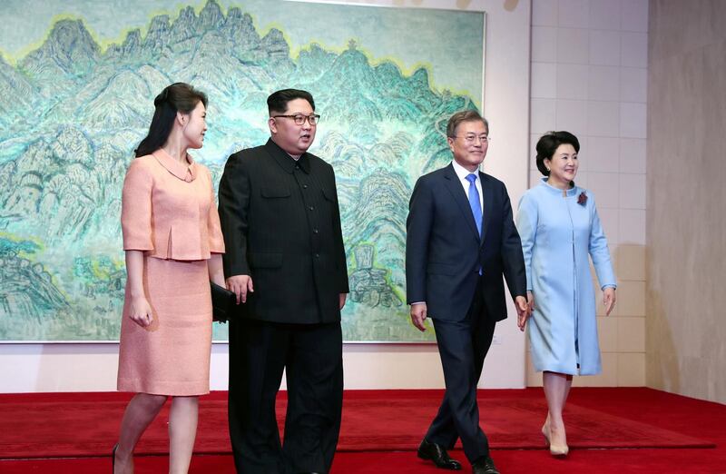 North Korean leader Kim Jong-un walks with his wife, Ri Sol-ju and South Korean President Moon Jae-in and with his  wife Kim Jung-sook. Press Pool / Pool via Reuters