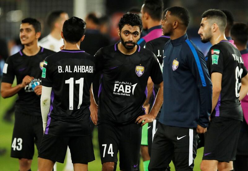 Soccer Football - Club World Cup - Final - Real Madrid v Al Ain - Zayed Sports City Stadium, Abu Dhabi, United Arab Emirates - December 22, 2018  Al-Ain's Hussein El Shahat and team mates look dejected after the match  REUTERS/Andrew Boyers