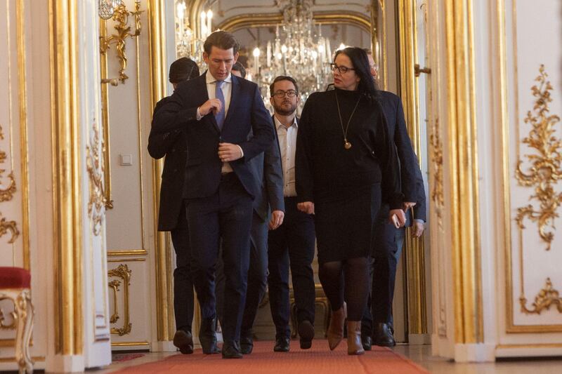 Head of he Austria People's Party (OevP) Sebastian Kurz (L) arrives for the presentation of the newly-formed coalition government's programme on January 2, 2020 at Hofburg palace in Vienna.  Kurz said that his conservatives and the Greens had got an "excellent result" in difficult negotiations to form a coalition government. / AFP / ALEX HALADA
