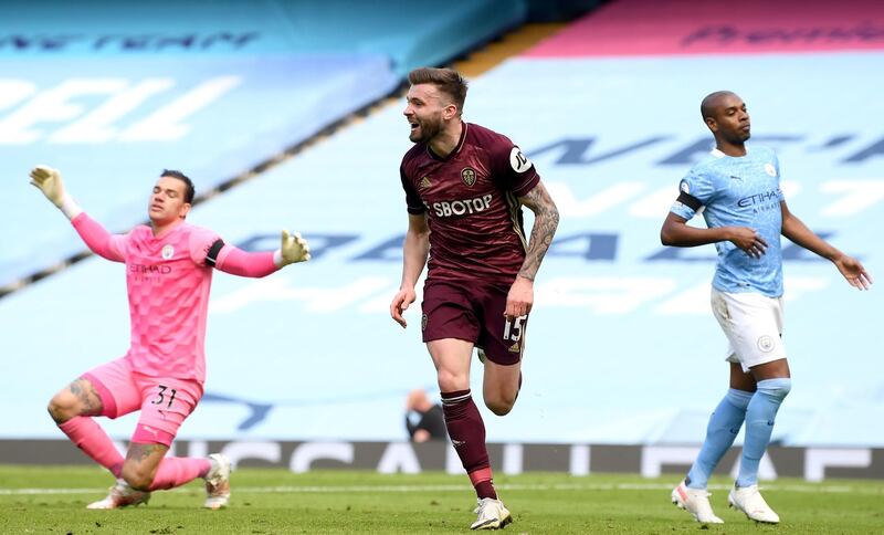 Leeds United's Stuart Dallas celebrates scoring their side's first goal of the game during the Premier League match at the Etihad Stadium, Manchester. Picture date: Saturday April 10, 2021. PA Photo. See PA story SOCCER Man City. Photo credit should read: Michael Regan/PA Wire. 

RESTRICTIONS: EDITORIAL USE ONLY No use with unauthorised audio, video, data, fixture lists, club/league logos or "live" services. Online in-match use limited to 120 images, no video emulation. No use in betting, games or single club/league/player publications.