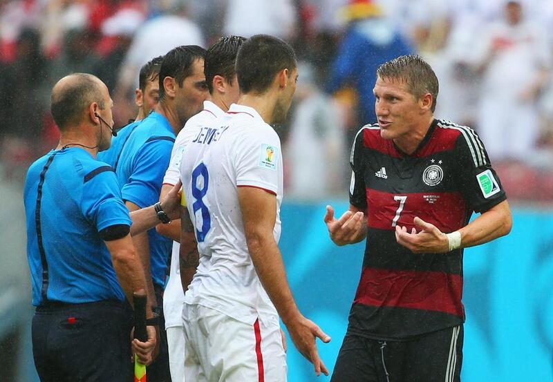 Bastian Schweinsteiger of Germany and Clint Dempsey of the United States react during their match on Thursday at the 2014 World Cup. Robert Cianflone / Getty Images