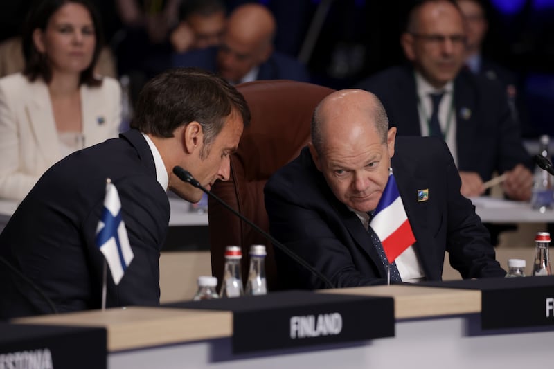 President of France Emmanuel Macron and German Chancellor Olaf Scholz hold a discussion. Getty Images
