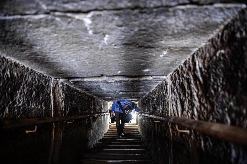 A man walks through a passage in the well-known bent pyramid of King Sneferu. AFP