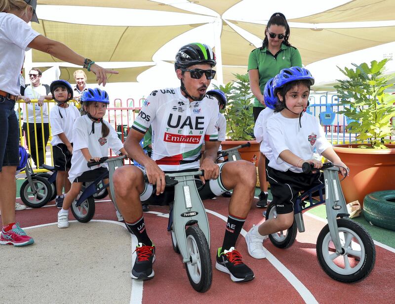 Abu Dhabi, U.A.E., October 29, 2018.  UAE Cycling Team Emirates visit the Al Yasmina School to give a brief cycling workshop. -- Yousif Mirza teaches some todlers how to bike on a play track.
Victor Besa / The National
Section:  SP
Reporter:  Amith Passela