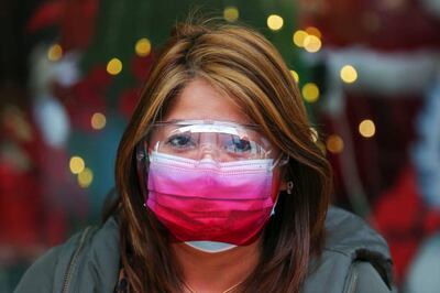 A woman ensures she is well protected during lockdown in Wellington on Wednesday. Getty Images