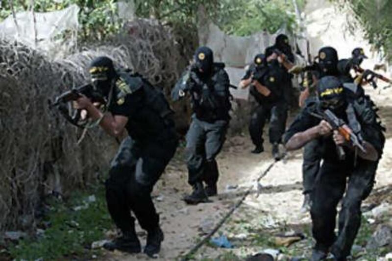 Masked Palestinian fighters of Saraya al Quds take part in training session in Khan Younis, in southern Gaza Strip on Dec 23 2008. A six-month ceasefire between Israel and Hamas ended last week, with senior Israeli government officials warning that a military offensive in the Gaza Strip will be unavoidable if the rocket fire from the territory continues.